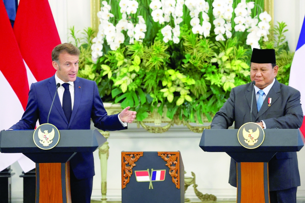 French President Emmanuel Macron speaks during a press conference with Indonesian President Prabowo Subianto at the Merdeka Palace in Jakarta. — Reuters