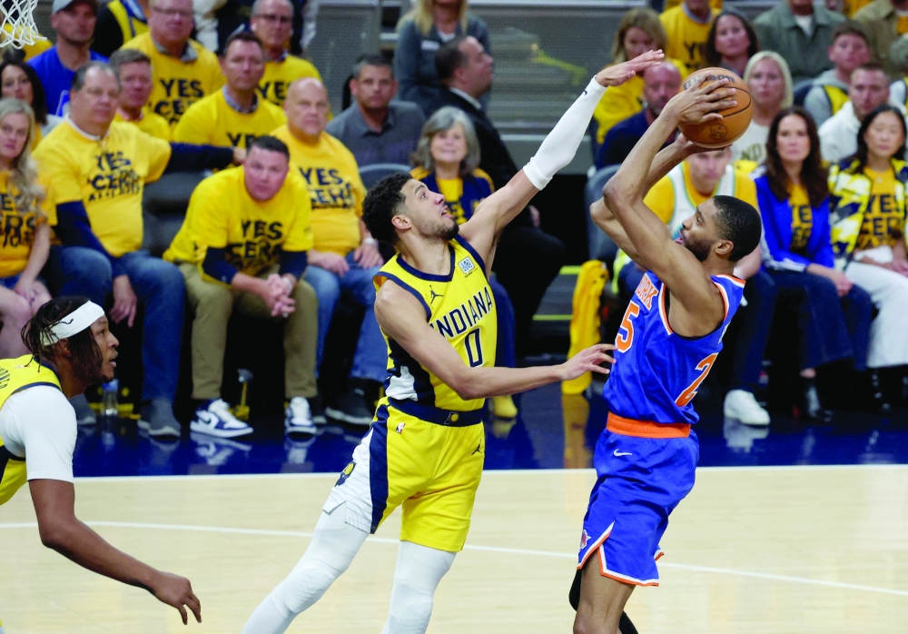 Mikal Bridges shoots a layup over Indiana Pacers guard Tyrese Haliburton. — Reuters
