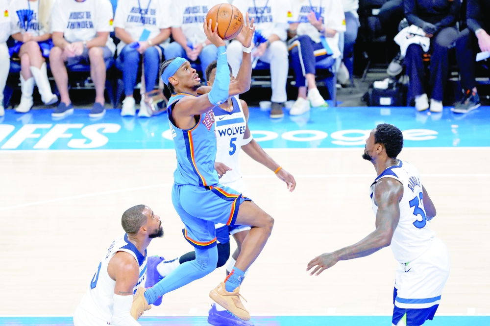 Shai Gilgeous-Alexander (2) shoots the ball against guard Mike Conley (10). — Reuters