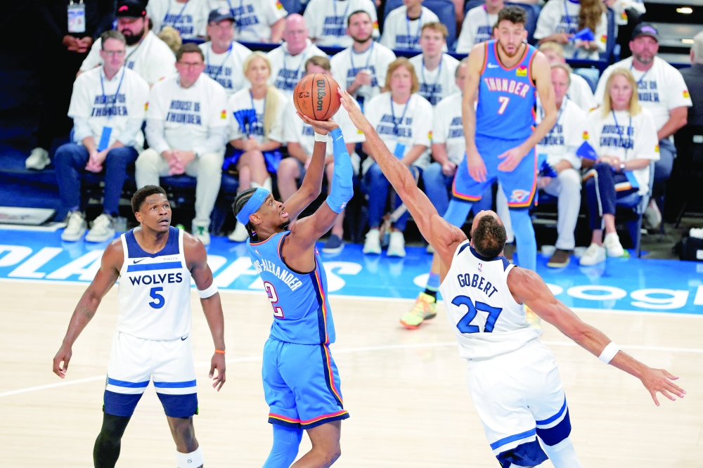 Shai Gilgeous-Alexander (2) shoots the ball against center Rudy Gobert (27). — Reuters 
