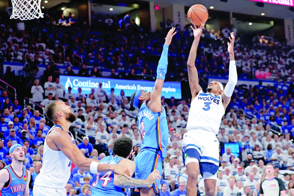 Jaden McDaniels (3) shoots the ball against Shai Gilgeous-Alexander (2). — Reuters 