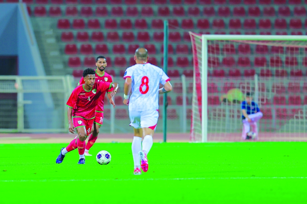 Oman and Lebanon players in action 