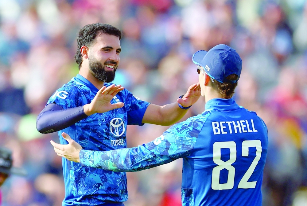England's Saqib Mahmood celebrates with Jacob Bethell. — Reuters