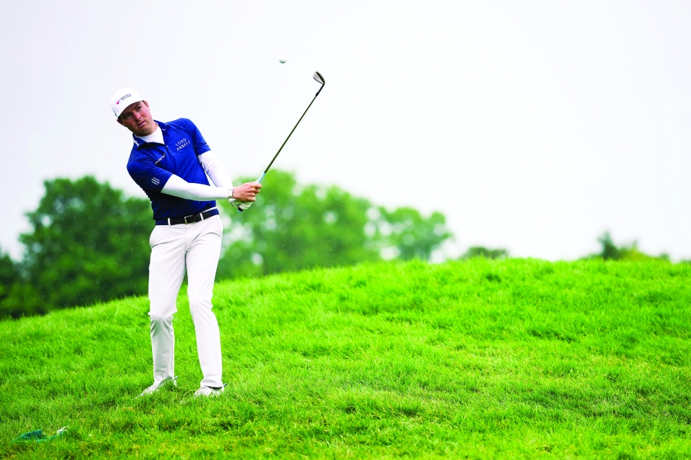  Nick Taylor putts on the 14th green during the second round. — Reuters 