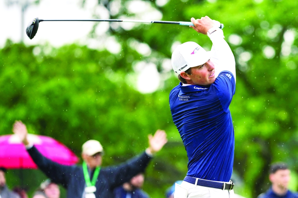 Ben Griffin plays his shot from the first tee. — Reuters
