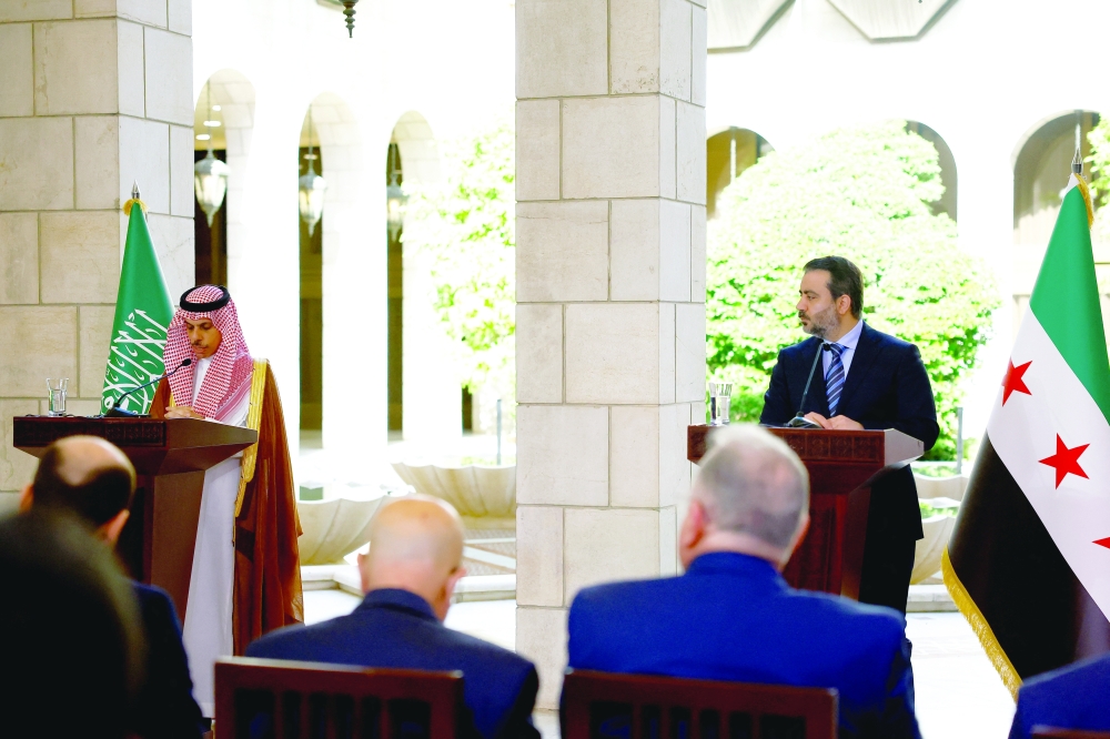 Saudi FM Prince Faisal bin Farhan al Saud and Syrian FM Asaad Hassan al Shibani attend a press conference in Damascus. — Reuters