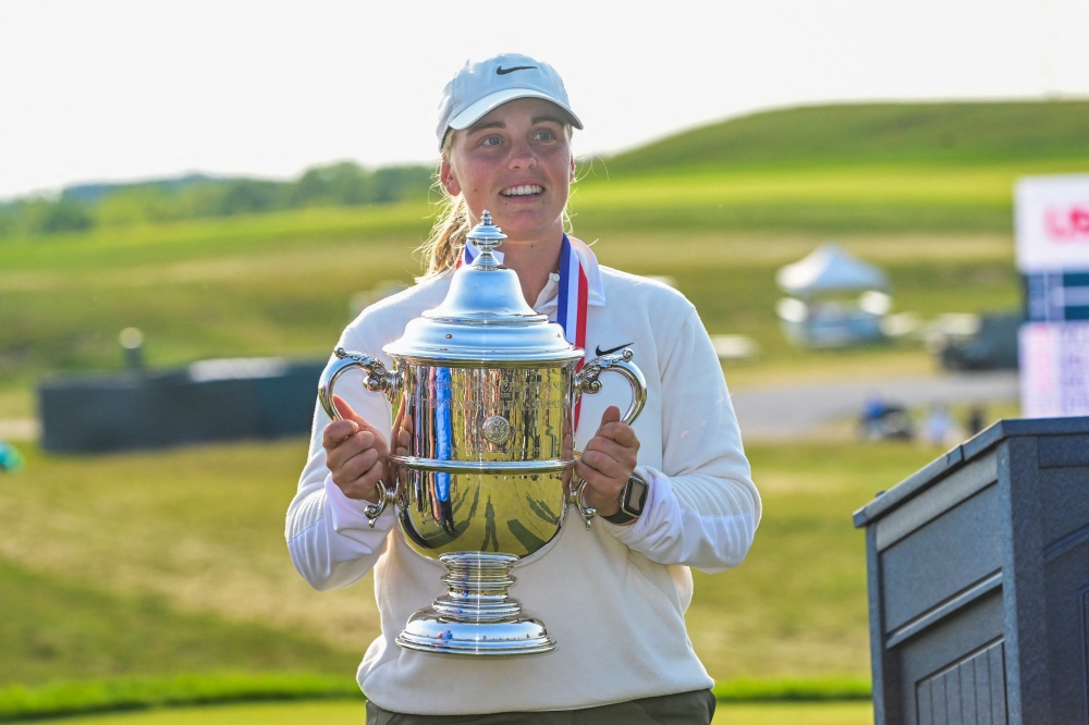  Maja Stark holds up championship trophy. — Reuters