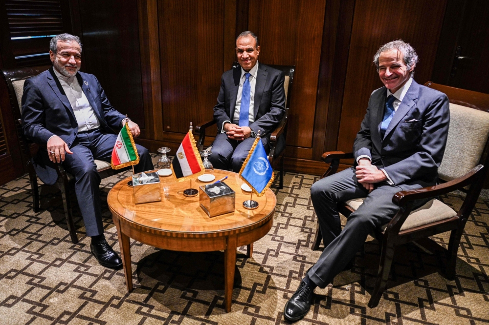 Egypt's FM Badr Abdelatty (C) meets with his Iranian counterpart Abbas Araghchi (L) and Rafael Grossi, Director General of the International Atomic Energy Agency in Cairo. — AFP