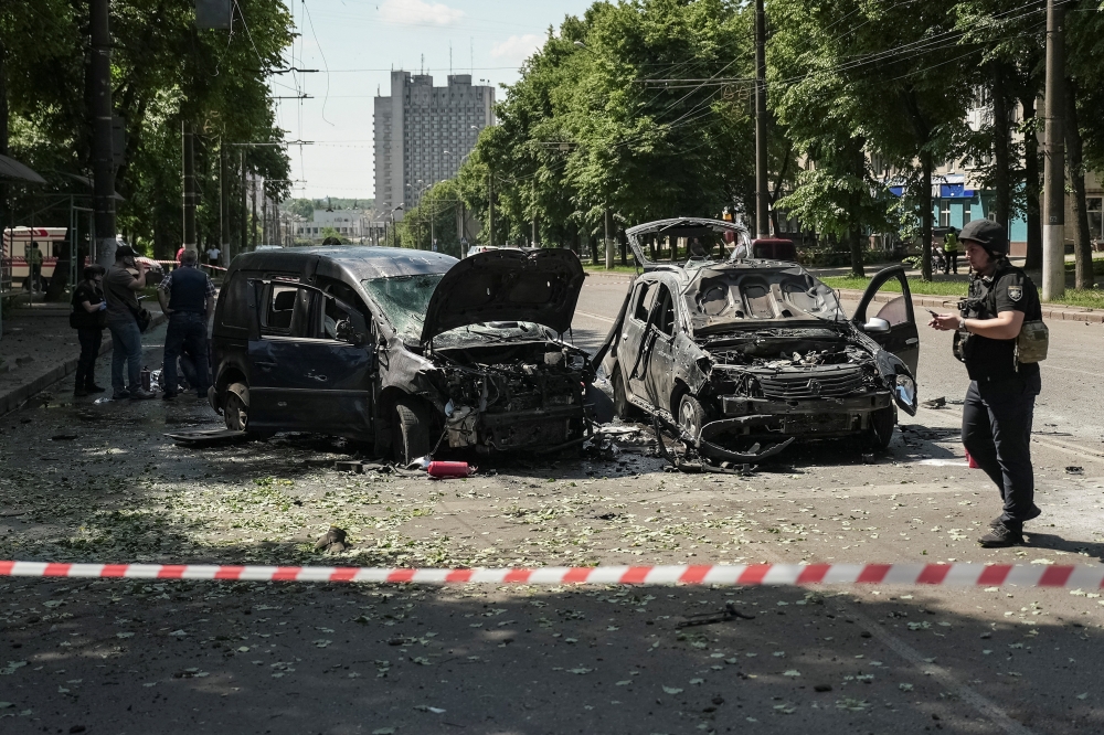 Police officers stand at the site of Russian missile strike, amid Russia's attack on Ukraine in Sumy. — Reuters