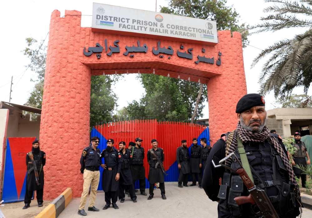 Paramilitary soldiers stand outside the district Malir jail, in Karachi, Pakistan. — Reuters