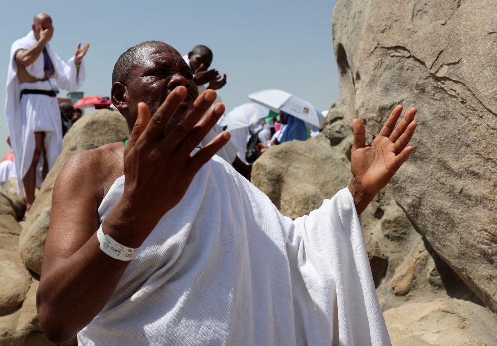A Muslim pilgrim prays at Jabal Al Rahmah, also known as Mount Arafat, during the annual Haj pilgrimage, outside the holy city of Mecca on Thursday. — Reuters
