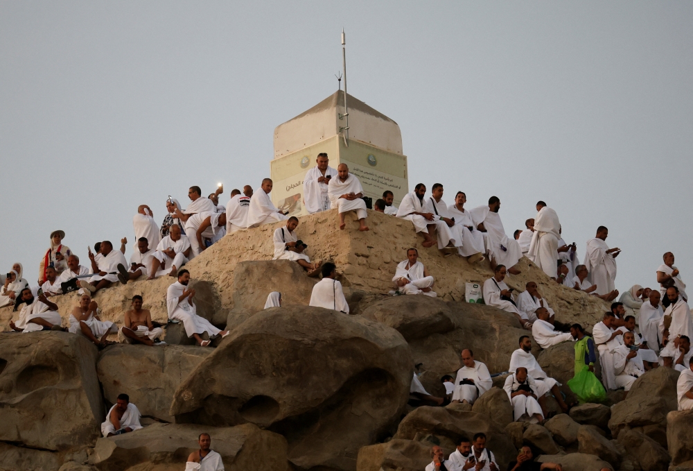 Muslim pilgrims gather to pray at Jabal Al Rahmah, also known as Mount Arafat, during the annual haj pilgrimage, outside the holy city of Mecca on Thursday. — Reuters
