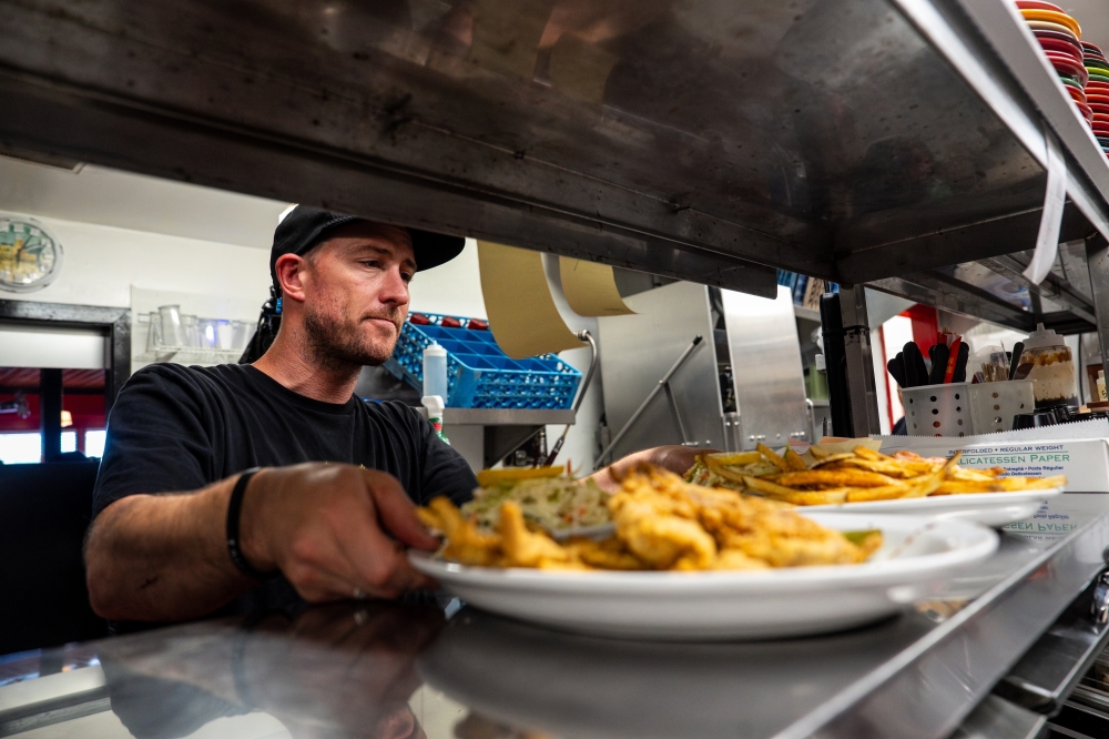 Dishes are preapred at Lucky 12 Tavern in Nags Head, N C. — The New York Times