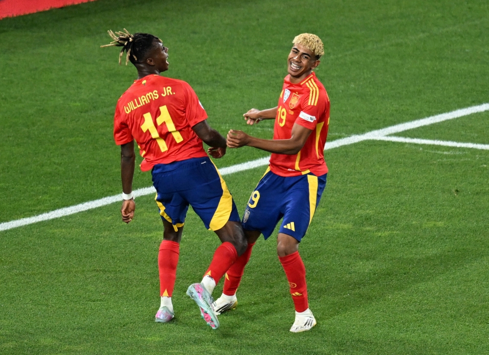 Spain's Yamal celebrates scoring goal with Williams. — Reuters
