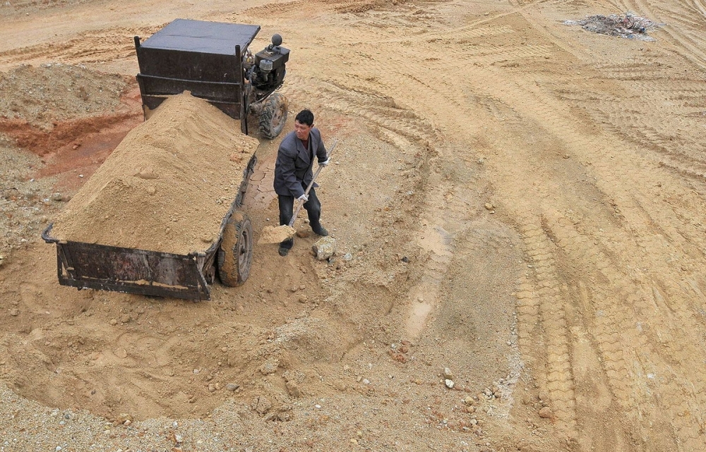 A labourer works at a site of a rare earth metals mine in China's Jiangxi province. — Reuters