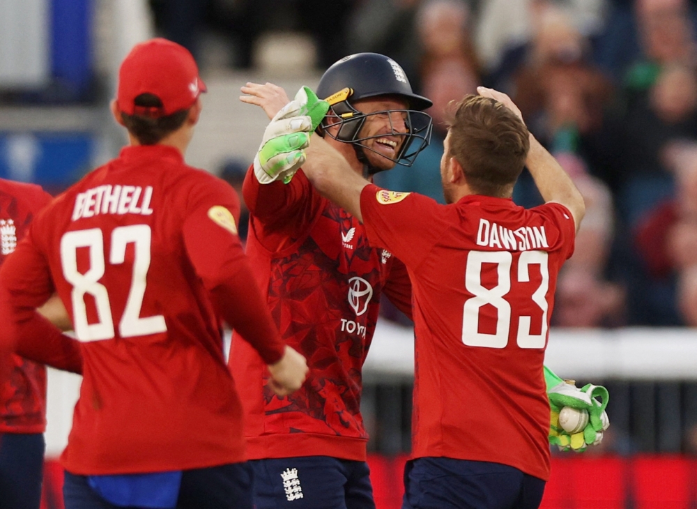 Cricket - First Twenty20 International - England v West Indies - Seat Unique Riverside, Durham, Britain - June 6, 2025 England's Jos Buttler celebrates with Liam Dawson after he takes the wicket of West Indies' Johnson Charles, stumped off the bowling of England's Liam Dawson Action Images via Reuters/Lee Smith
