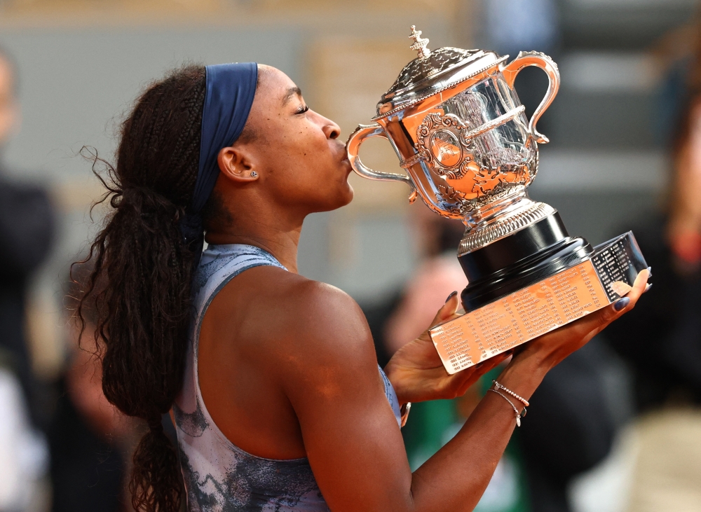 Coco Gauff celebrates with the trophy. — Reuters 