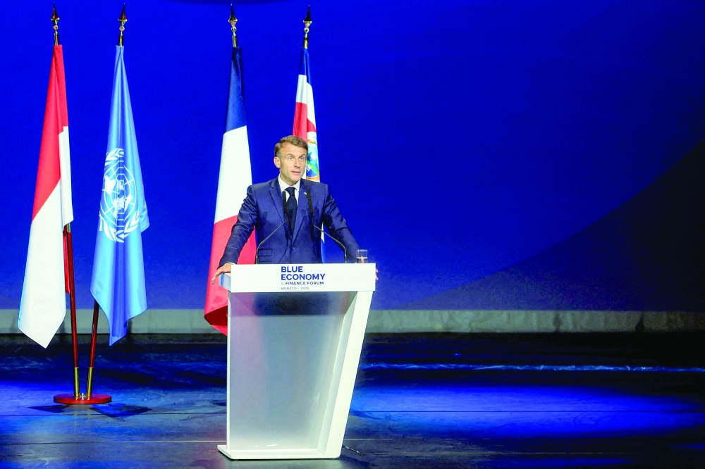 France's President Emmanuel Macron delivers a speech at the Blue Economy and Finance Forum (BEFF), in Monaco. — AFP