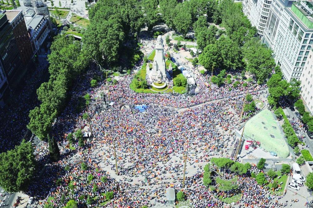 Protesters gather in Plaza de Espana square in Madrid. 