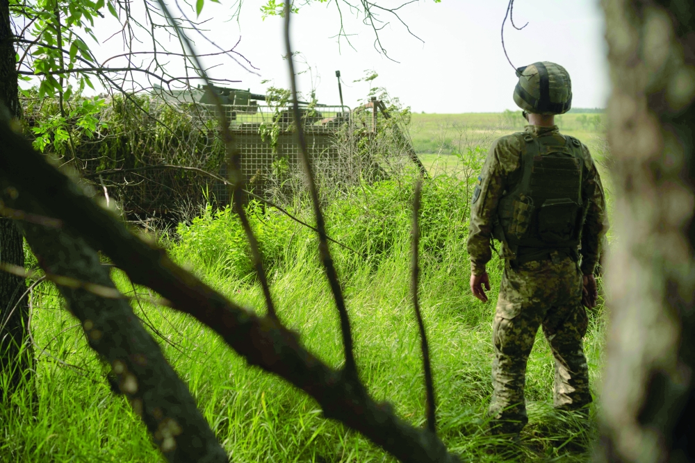 A Ukrainian soldier watches during extraction training, in eastern Ukraine. — AFP