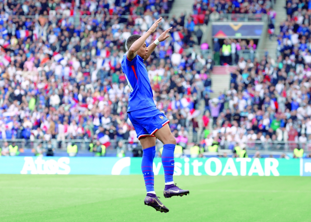 France's Kylian Mbappe celebrates scoring their first goal. —  Reuters