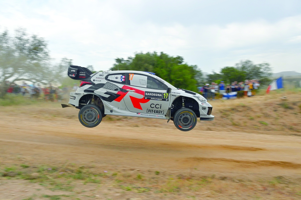 France's Sebastien Ogier and his co-driver France's Vincent Landais steer their Toyota GR Yaris Rally1 Hybrid. — AFP