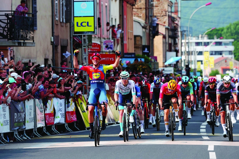 Lidl-Trek's Jonathan (L) celebrates after crossing finish line. — AFP