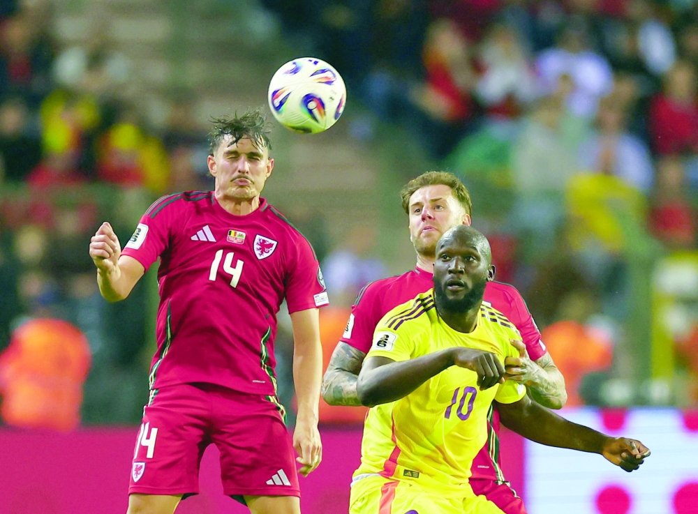 Wales' Connor Roberts in action with Belgium's Romelu Lukaku. — Reuters