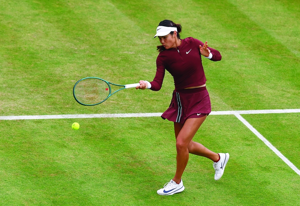 Britain's Emma Raducanu in action during her doubles quarterfinal match with Katie Boulter. — Reuters