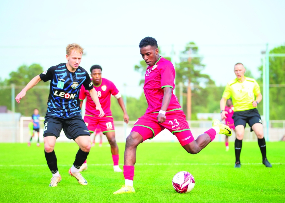 Oman and Saturn Ramenskoye FC player in action