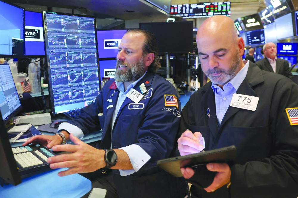 Traders work on the floor at the New York Stock Exchange (NYSE) in New York City. — Reuters