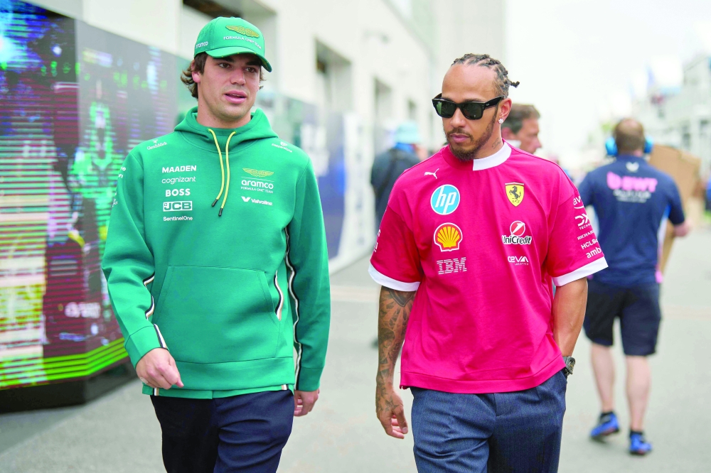 Lance Stroll and Ferrari's British driver Lewis Hamilton. — AFP