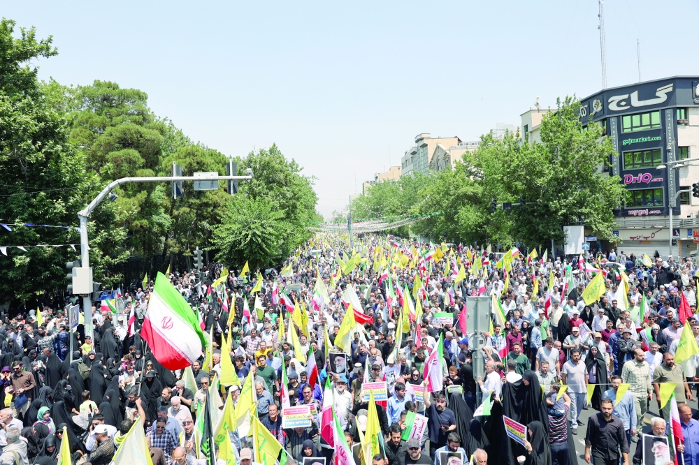 People attend an anti-Israeli protest following the Israeli strikes on Iran, in Tehran, Iran, on Friday. — Reuters