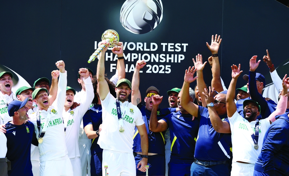 South Africa's Aiden Markram lifts the ICC Test Championship Mace with teammates. — Reuters