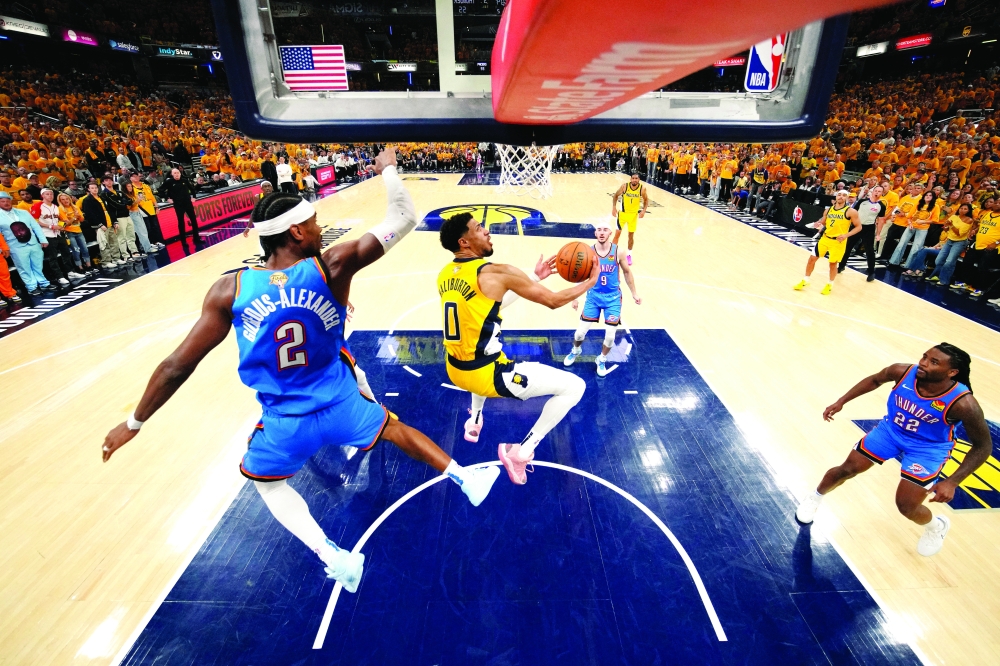Indiana Pacers guard Tyrese Haliburton (0) shoots the ball against Oklahoma City Thunder guard Shai Gilgeous-Alexander (2). — Reuters