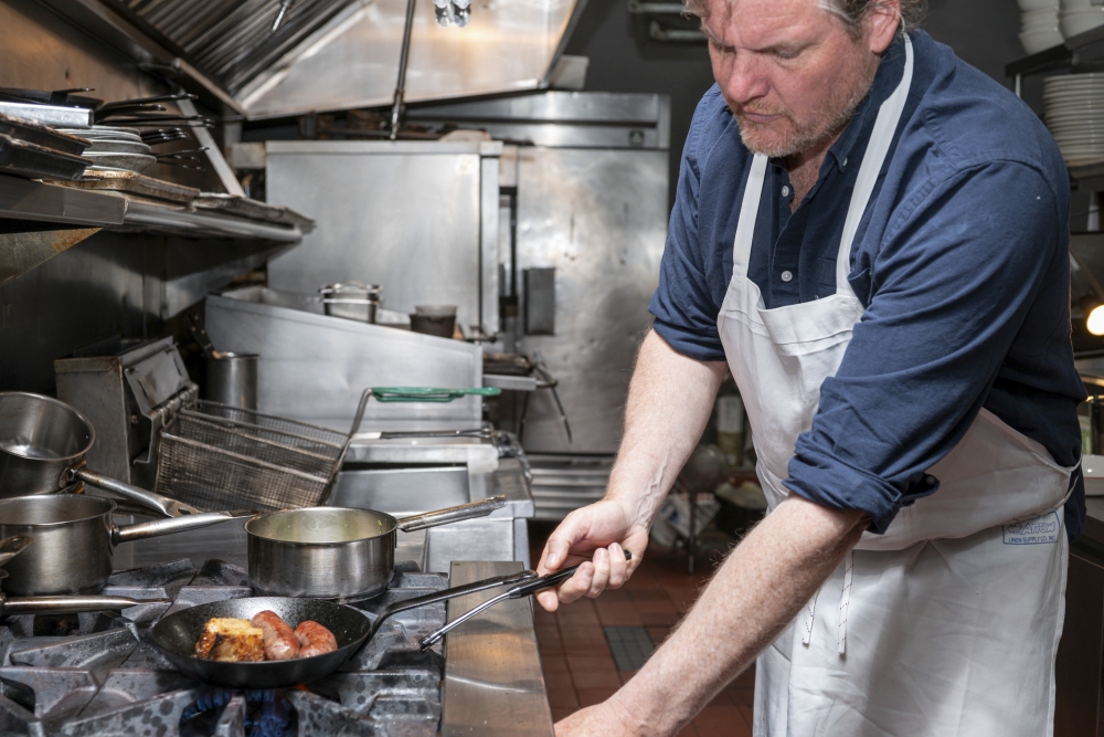 Ned Baldwin, the chef and owner of Houseman in Manhattan, May 29, 2025. Baldwin asked for ChatGPT’s help in understanding technical details of sausage-making. (Emon Hassan/The New York Times)