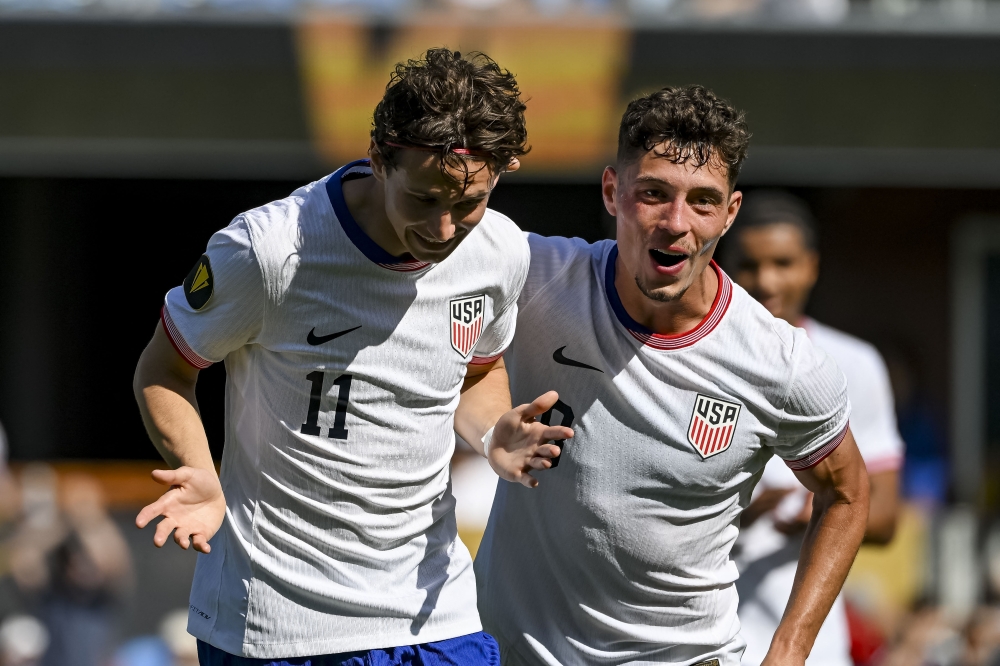 USA midfielder Brenden Aaronson (11) and team USA celebrates after scoring the fourth goal. — Reuters