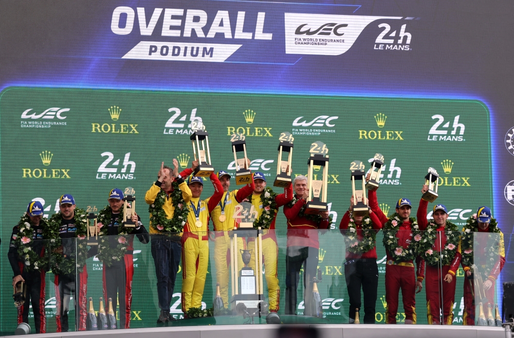 AF Corse's Robert Kubica, Yifei Ye and Philip Hanson celebrate on the podium. — Reuters