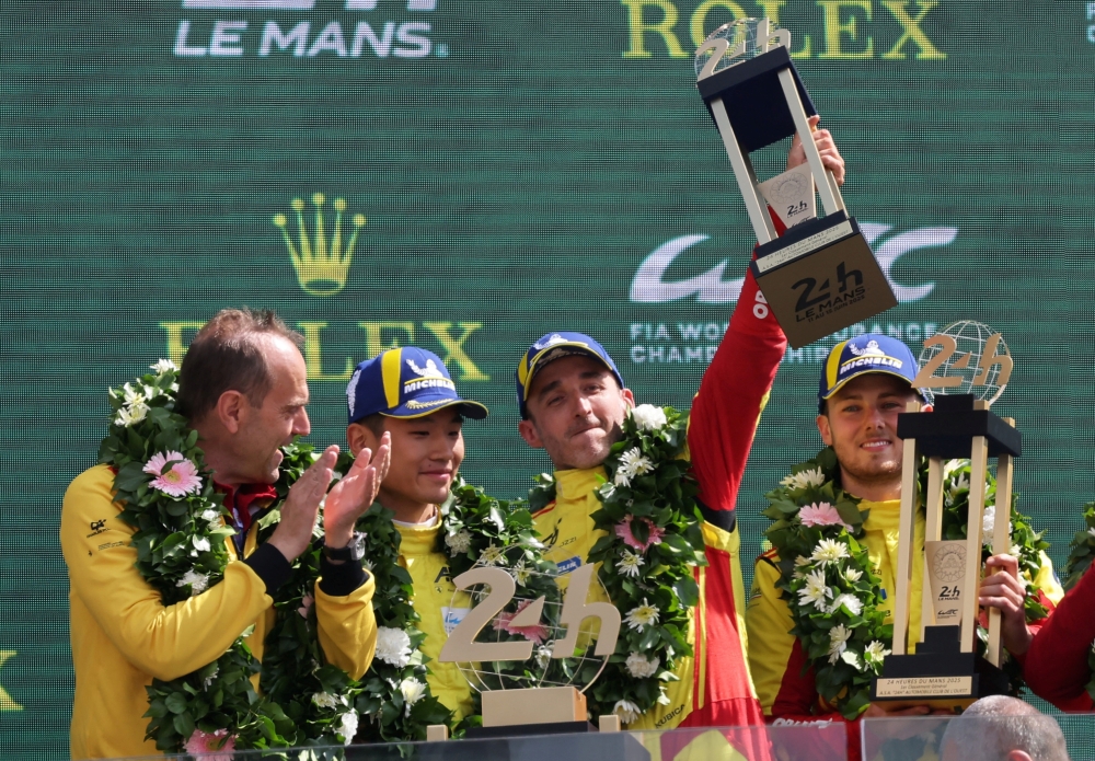  AF Corse's Robert Kubica, Yifei Ye and Philip Hanson celebrate on the podium. — Reuters