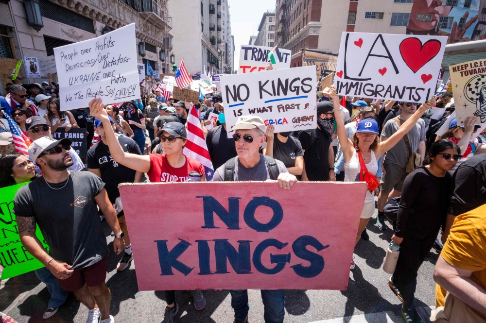 Demonstrators take part in a protest during national rally in downtown Los Angeles. — AFP