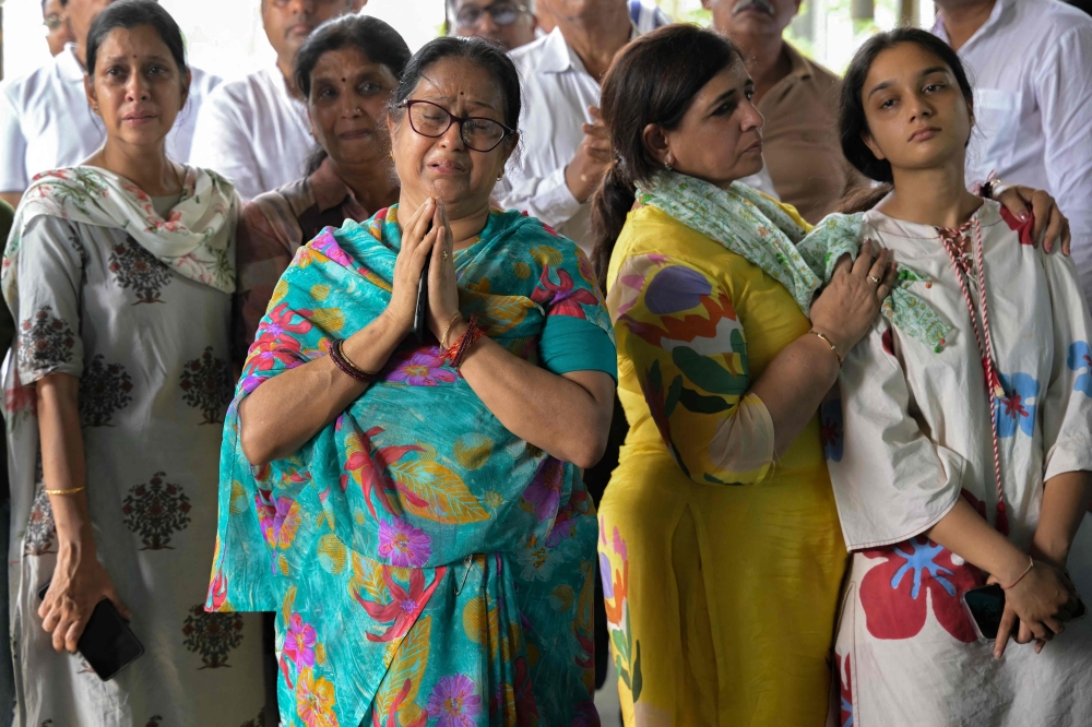 Relatives mourn during funerals 