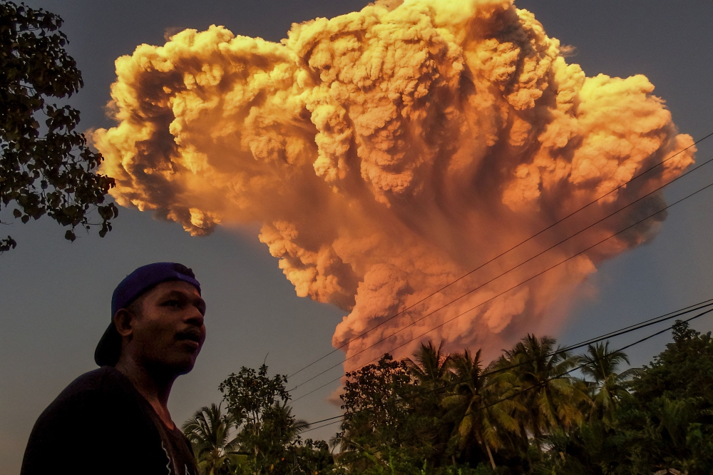 A villager watches the eruption