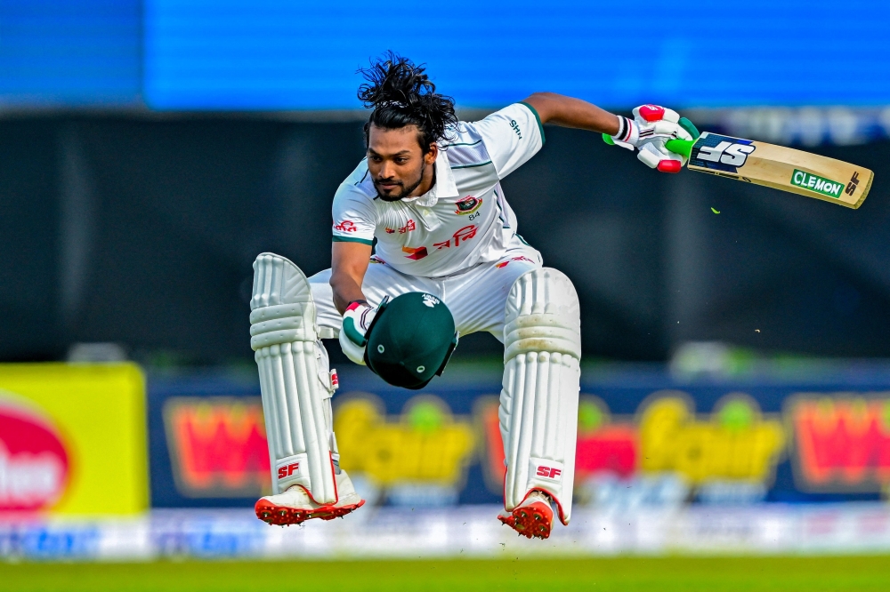 Bangladesh's captain Najmul Hossain Shanto celebrates after scoring a century (100 runs). — Reuters 
