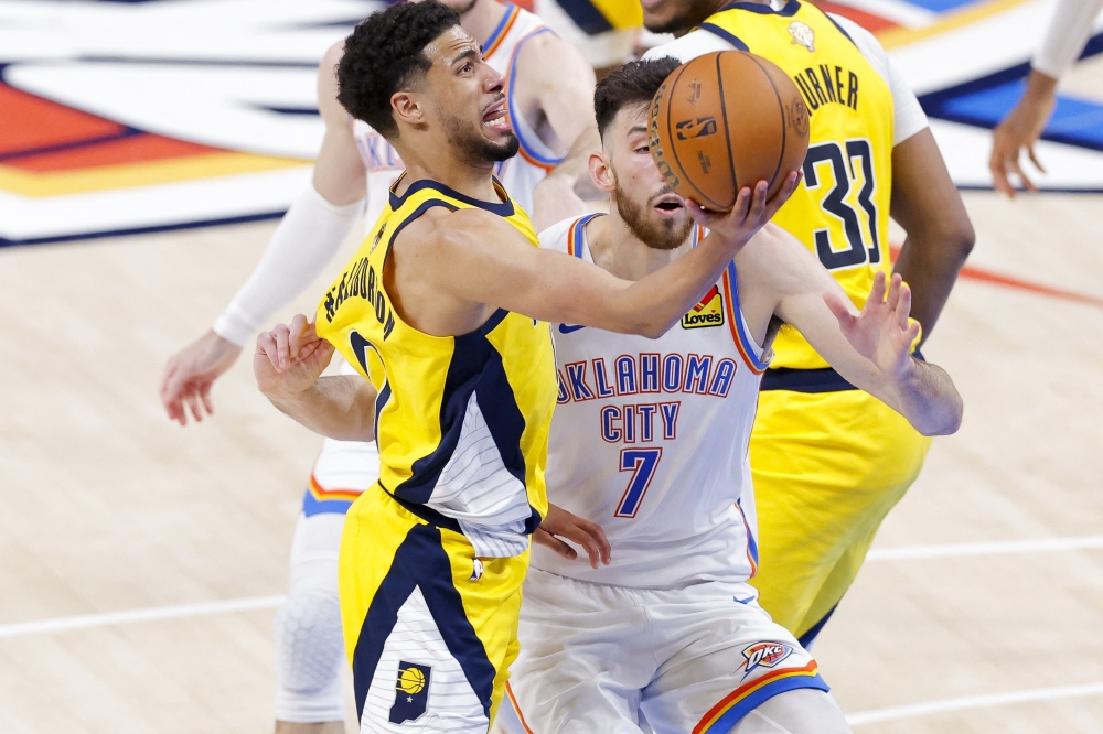 Indiana Pacers guard Tyrese Haliburton (0) drives to the basket past Oklahoma City Thunder forward Chet Holmgren (7) . — Reuters