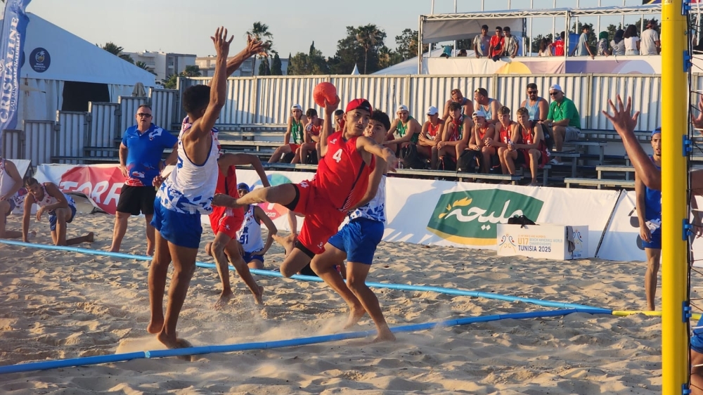 Oman player aims at the goal