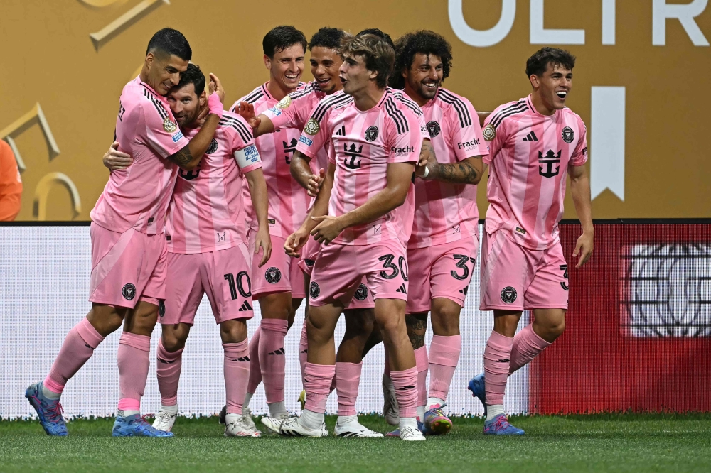 Inter Miami's Messi (2ndL) celebrates with teammates after scoring. — AFP