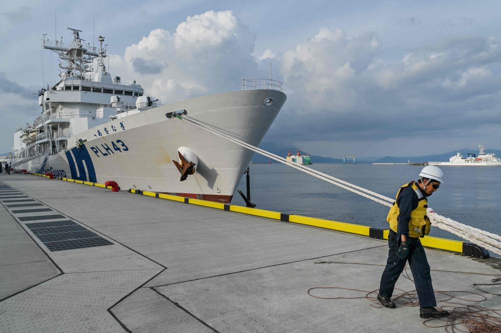 The Japan Coast Guard ship 'Asanagi' returns from a maritime exercise with the Philippine Coast Guard ship 'Teresa Magbanua' and the US Coast Guard ship 'Cutter Stratton' in the waters around the southern city of Kagoshima, Kagoshima prefecture. - AFP