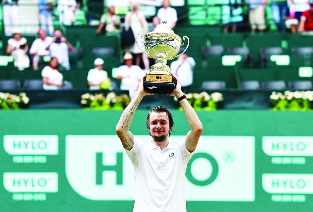 Kazakhstan's Alexander Bublik celebrates with the trophy. — Reuters