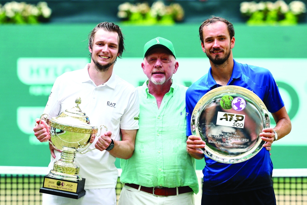 Kazakhstan's Alexander Bublik and runner-up Russia's Daniil Medvedev during the trophy presentation. — Reuters 