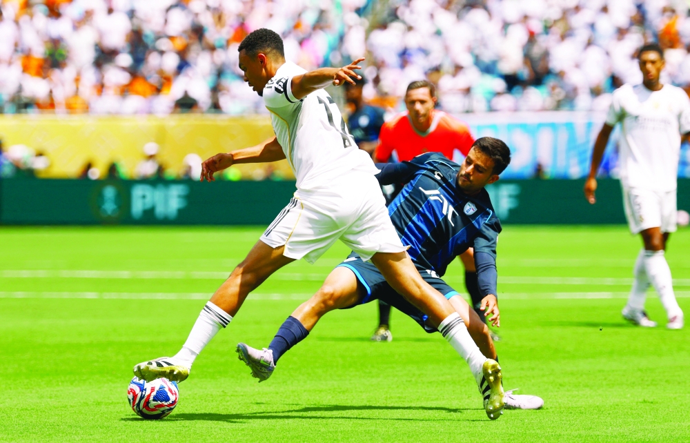 Real Madrid's Trent Alexander-Arnold in action with Pachuca's Elias Montiel. — Reuters